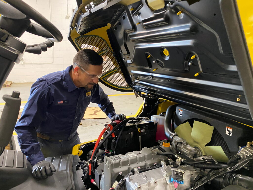 LiftOne technician working on a motor